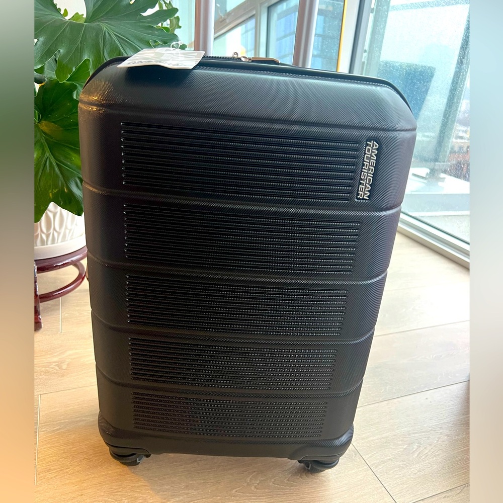 NEW IN BOX! American Tourister 20” Carry On Spinner